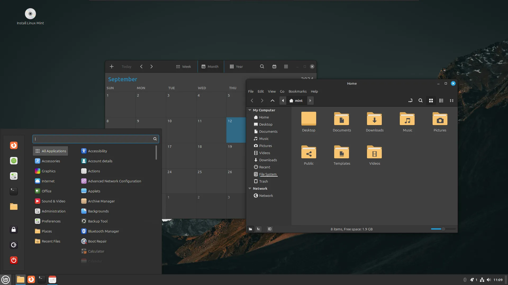 Giao diện Linux Mint desktop với ứng dụng lịch và trình duyệt tệp mở, minh họa môi trường làm việc quen thuộc trên USB Live Linux di động.