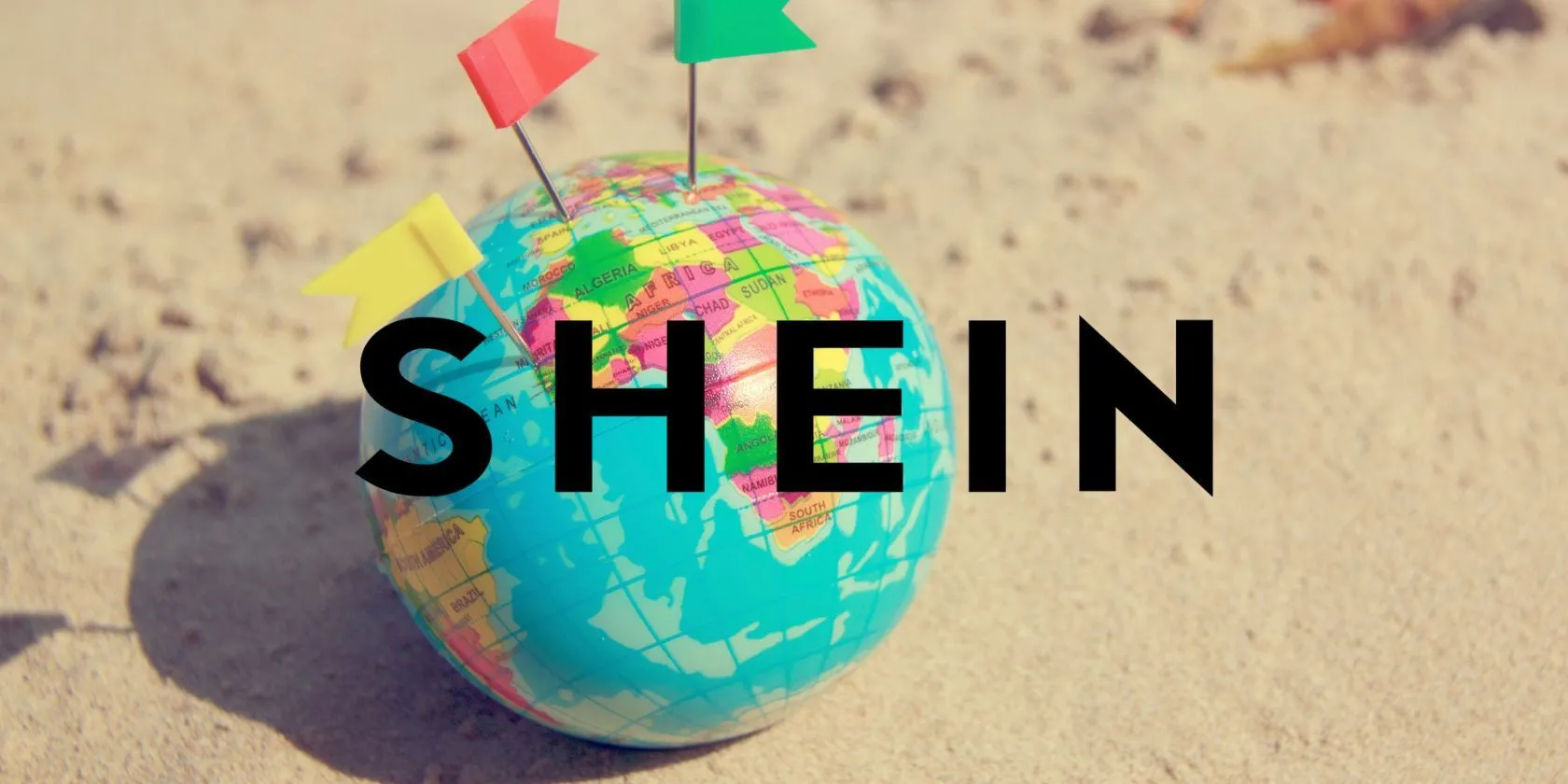 Logo Shein nổi bật trên nền quả địa cầu nhỏ, biểu tượng cho dịch vụ khách hàng toàn cầu và mua sắm trực tuyến